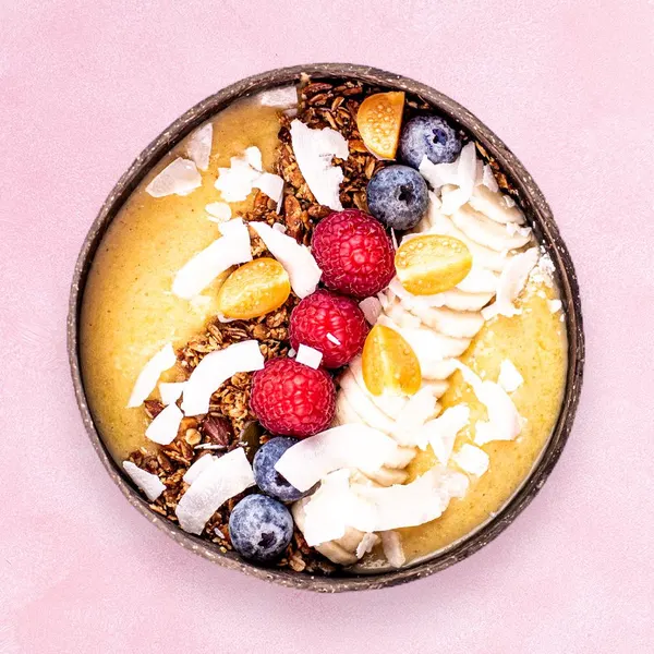 Mango Bowl with mango, pineapple, banana, chia, flaxseed, granola, fresh fruit