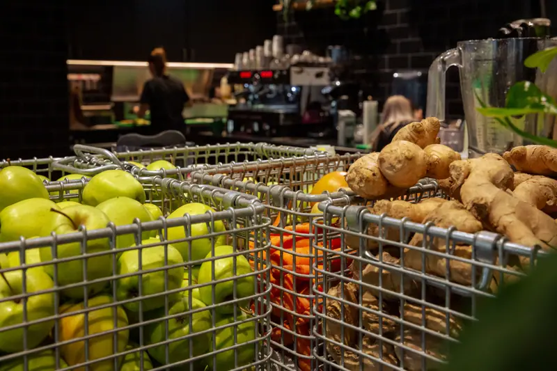 Apples and ginger in wire baskets